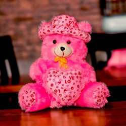 Cuddling Pink Teddy Bear with Hat